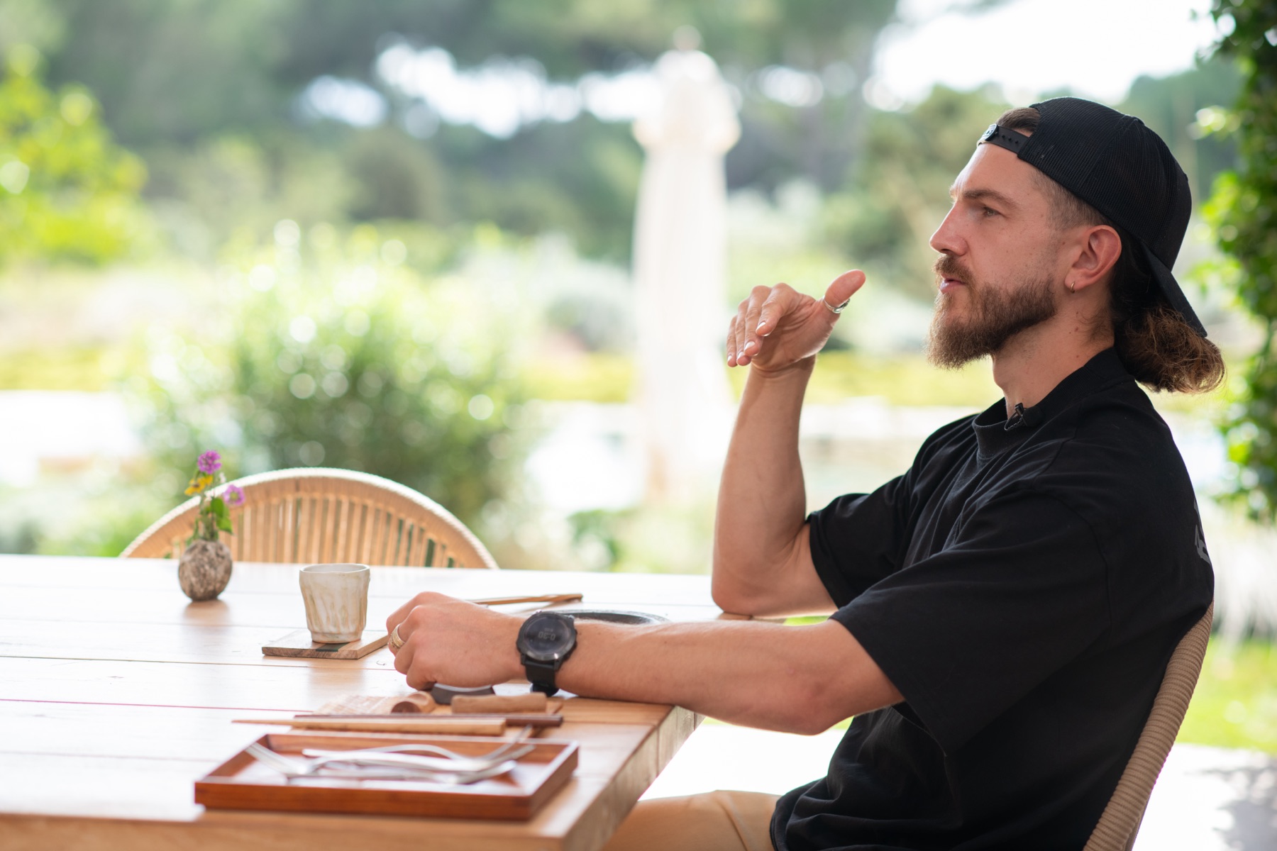Callum Hardingham interviewed at an outdoor table in Ibiza