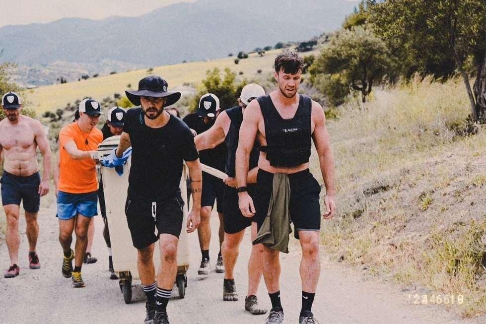 The group under load on a mountain road