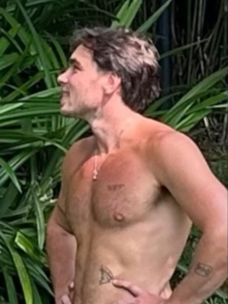 Mitch after FIT10, lean among tropical foliage